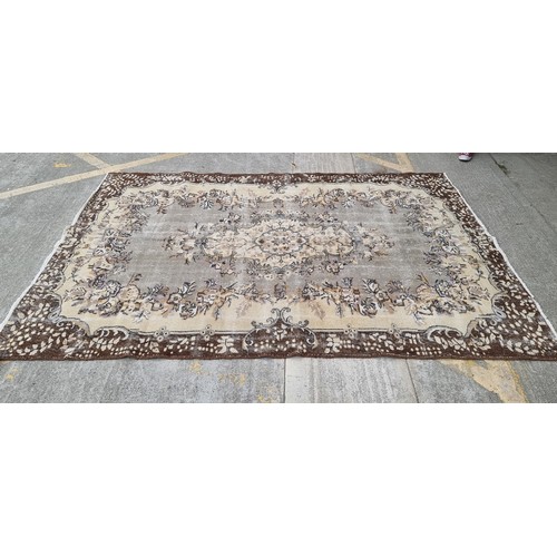 880 - Star Lot : A nice large, Vintage  hand made Handnotted Turkish wool on Cotton rug in shades of fawn,... 