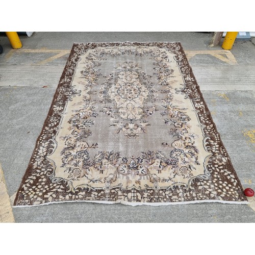 880 - Star Lot : A nice large, Vintage  hand made Handnotted Turkish wool on Cotton rug in shades of fawn,... 