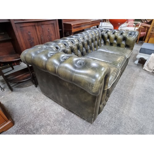 855 - Star Lot : A fabulous vintage Chesterfield  leather three-seater sofa with button back detailing to ... 