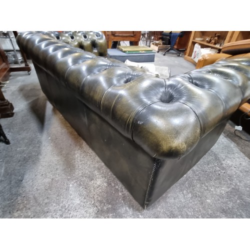 855 - Star Lot : A fabulous vintage Chesterfield  leather three-seater sofa with button back detailing to ... 