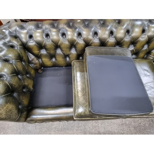 855 - Star Lot : A fabulous vintage Chesterfield  leather three-seater sofa with button back detailing to ... 