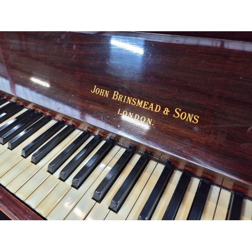 856 - A gorgeous antique early 20th century upright piano by John Brinsmead & Sons complete with two pedal... 