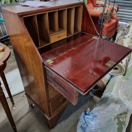 917 - Star Lot : A wonderful Edwardian honey mahogany secretary desk with a drop down table top placed on ... 