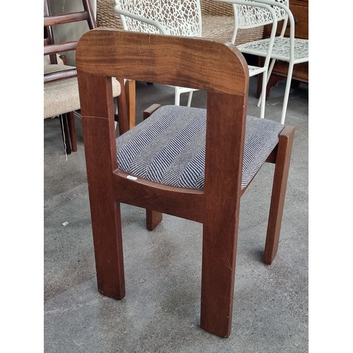 448 - A set of four fabulous Mid Century Modern dining chairs with sleek wooden frames featuring a carved ... 