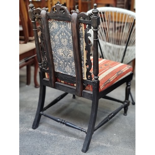 451 - A fantastic antique Jacobean style occasional chair with elaborate carved scroll and foliate detaili... 