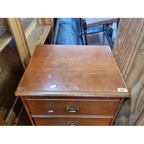 866 - A tallboy with five drawers with brass drop pull handles. The top lifts up to reveal a Mirror and sp... 