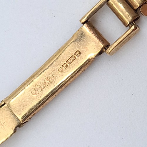 21 - A fabulous vintage 9 carat gold identity bracelet, set nicely with Greek Key inspired links and blan... 