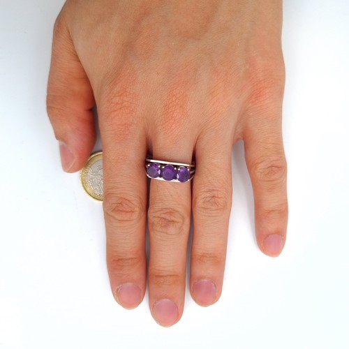 29 - Star Lot : A fabulous 14 carat marked White gold three stone Amethyst ring. This ring showcases larg... 