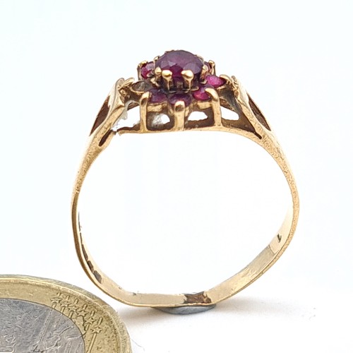 32 - Star Lot: An exquisite 9 carat gold Ruby cluster ring, set with floral clawed mount. Ring size: L. W... 