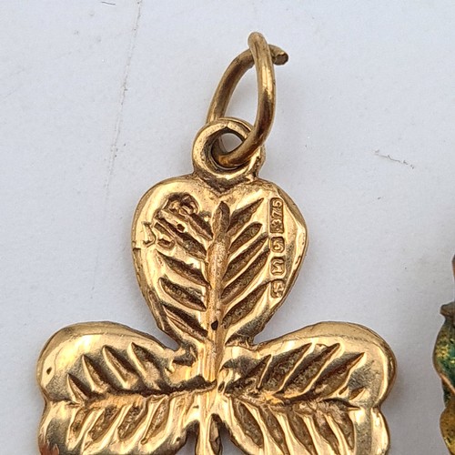 36 - Two 9 carat gold pendants, which includes a quaint Shamrock example which features etched detail. To... 