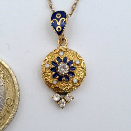 39 - Star Lot : A beautiful antique 12 carat gold circular gem stone pendant and chain, set with Sapphire... 