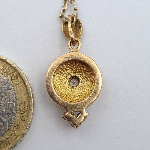 39 - Star Lot : A beautiful antique 12 carat gold circular gem stone pendant and chain, set with Sapphire... 