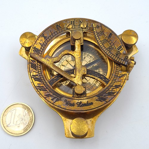 55 - A good brass compass with a built in sundial, set in wooden presentation box which features nautical... 