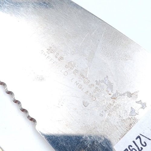 56 - A fine example of a sterling silver handled cake knife, featuring a stunning profuse foliate body. H... 