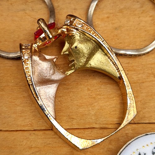 A collection of twelve items, comprising of five rings, a pill box, a wrist watch, a vintage lighter