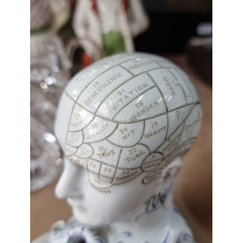 106 - A ceramic 19th century Phrenology bust pen-stand. This charming example features a phrenology bust w... 