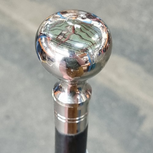 164 - A handsome walking cane with a polished steel pommel handle.