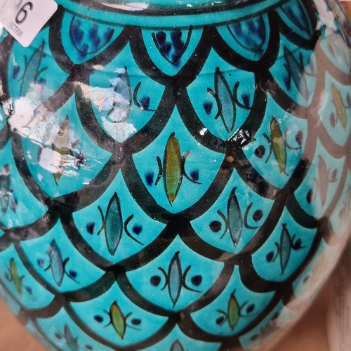 196 - A striking large globular ceramic vase with ogee pattern in a bright turquoise glaze. The estate of ... 