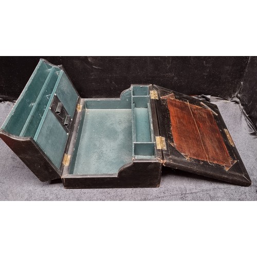 228 - A very handsome antique leather bound stationary box, with a myriad of internal compartments and met... 