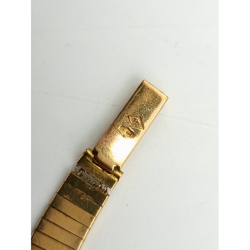 41 - Star Lot: A beautiful stylish vintage Omega 18 carat gold ladies wrist watch, stamped 750 to watch a... 