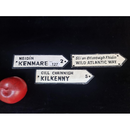 127 - A trio of neat sized cast metal finger pointing signs. Including bilingual signs for ''Wild Atlantic... 