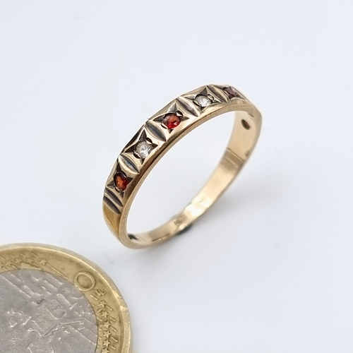 13 - A beautiful 9 carat gold half eternity ring, featuring star set Garnet and White Sapphire gem stones... 