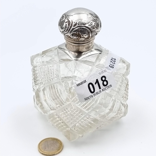 18 - A very large and heavy example of an antique Sterling silver screw topped perfume bottle, featuring ... 