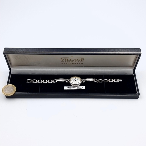 28 - A fine example of a sterling silver cased ladies wrist watch, featuring an associated silver bracele... 