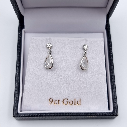 29 - A beautiful pair of 9 carat White gold gem set tear drop earrings, stamped 375 to posts. Weight: 1.2... 