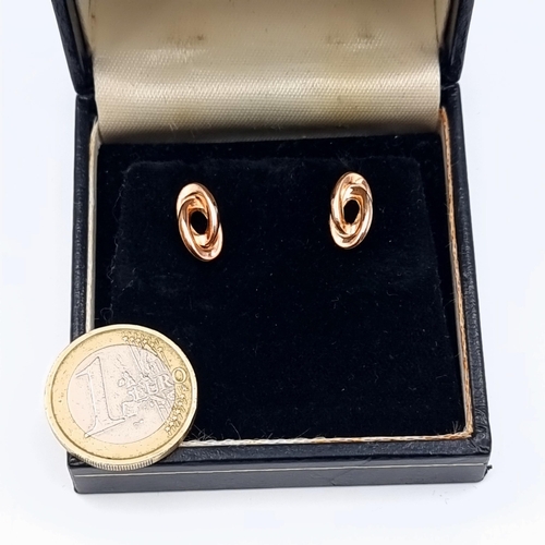 41 - A pair of as new twist mounted 9 carat gold earrings, set with stamped butterfly backs. Total weight... 