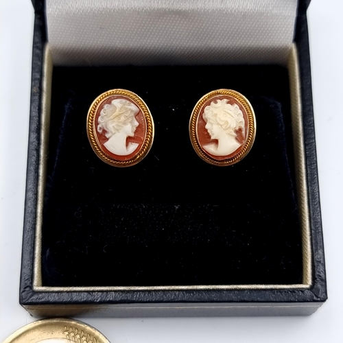 43 - An intricate pair of vintage 9 carat gold Cameo earrings, featuring stunning detail and rope twist b... 