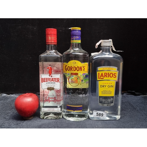 589 - Three sealed bottles of gin including a 70cl bottle of Beefeater london dry gin, a 70cl Gordans Lond... 