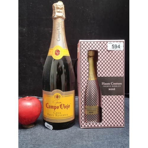 594 - Three sealed bottles including a 75cl Gran Campo Viejo Cava Brut Reserva and two 20cl bottles of hau... 