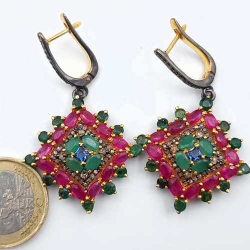 604 - Star Lot : A stunning pair of Indian inspired drop earrings, these amazing Emerald and Ruby earrings... 