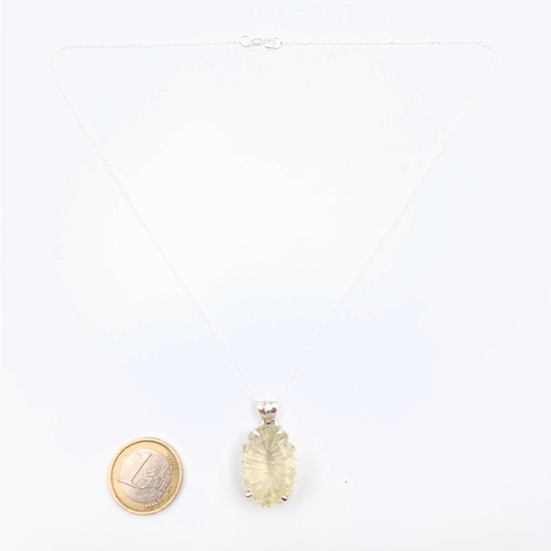 612 - A unusual concave cut natural Citrine stone necklace, which is set in sterling silver with a sterlin... 