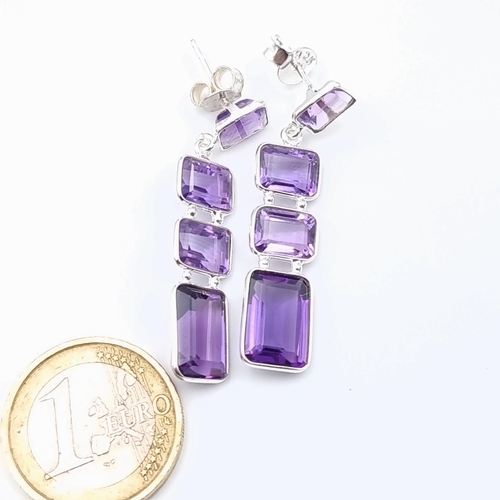 615 - A lovely pair of Amethyst three stone sterling silver drop pendant earrings, set with sterling silve... 