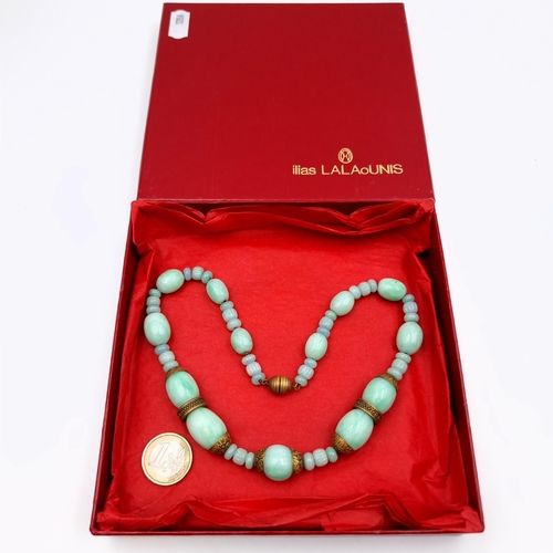 635 - A beautiful example of a graduated vintage natural Jade necklace, set with large beaded accents and ... 