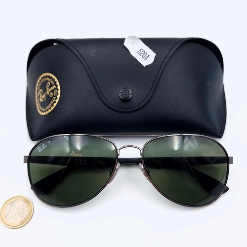 636 - A nice pair of designer aviator Ray-Ban's, set with black metal stems. Lenses in good condition. Enc... 