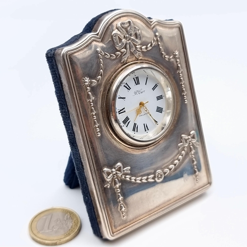 639 - A fine example of a miniature sterling silver Carrs of Sheffield desk clock, featuring a white ename... 