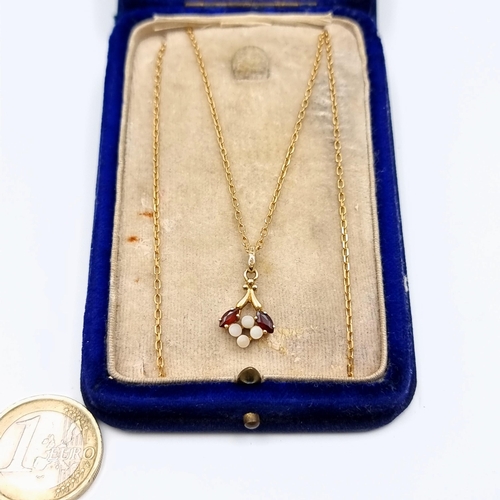 642 - Star Lot : A beautifully intricate antique art nouveau  9 carat gold Garnet and Opal drop pendant an... 