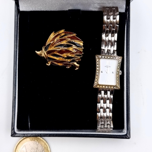 643 - An attractive gold and enamelled brooch, in the form of a hedge hog. Together with a vintage Rotary ... 