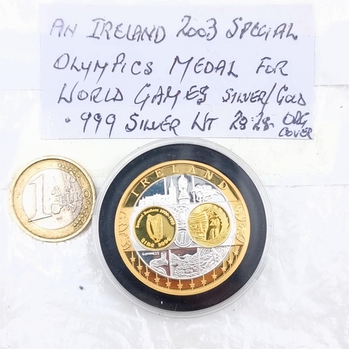 644 - An Irish 2003 special Olympics medal medallion for the world games, comprised of silver and gold. Of... 