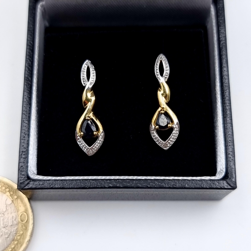 645 - An attractive pair of natural Sapphire drop stud earrings, set with twist drop mounts and are set in... 