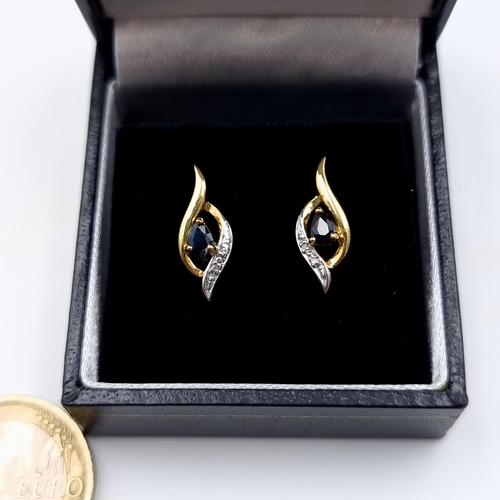 649 - A pair of 9 carat gold plated natural Sapphire stud earrings, set with pretty gem set detail. Encase... 