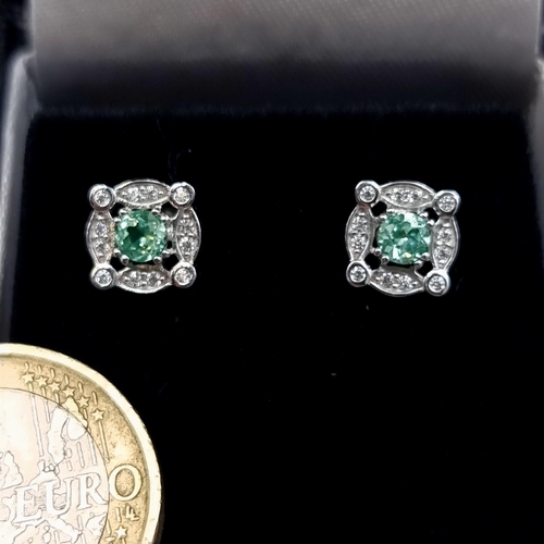 655 - A pair of sparkling sterling silver Spinel stone stud earrings, set with White Sapphire square mount... 