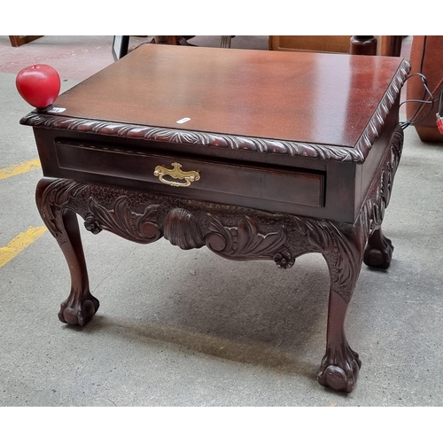 664 - An ornately craved Victorian style side table. Featuring detailed claw-and-ball feet with rope twist... 