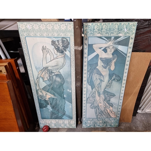 684 - Two very large wooden wall hangings featuring prints of works after artist Alfons Mucha. Depicting n... 