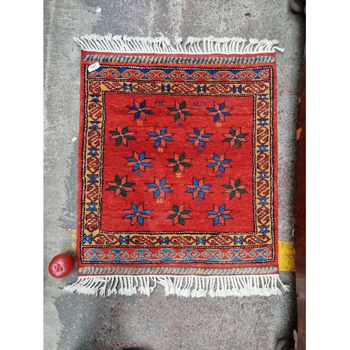 386 - A beautiful, incredibly vibrant hand knotted square prayer rug featuring geometric flower motifs in ... 