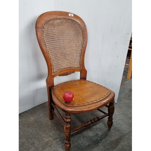 722 - A fantastic Victorian balloon back nursing chair with a woven wicker backrest, brass stud detailing ... 