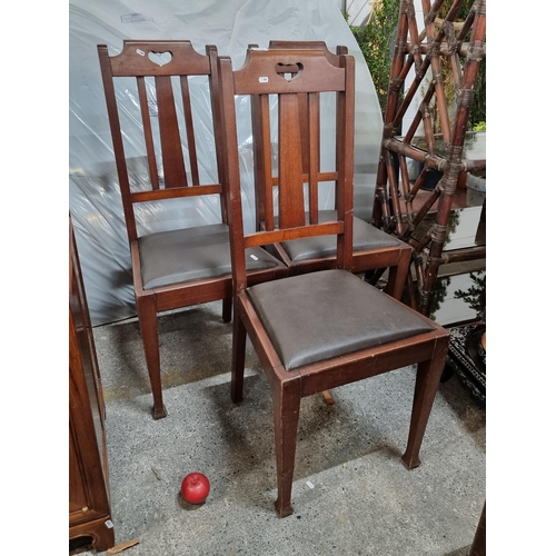 776 - A trio of very handsome splatback chairs, each featuring open carving to upper crest rail and tapere... 